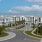 a building with palm trees and a parking lot