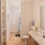bathroom with sink and backlit mirror