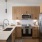 a kitchen with a white counter top with a sink and appliances 