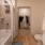 bathroom with walk in closet in the background