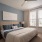 a bedroom with a bed and a fan