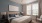 a bedroom with a bed and a fan