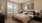 a bedroom with a bed and a fan
