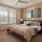 a bedroom with a bed and a fan