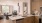 kitchen looking out to living room with ample lighting