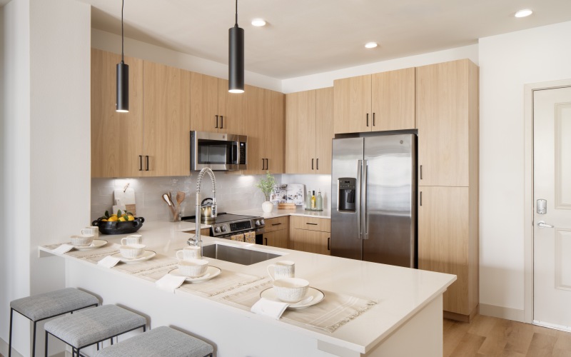 kitchen with white counter and bar stools