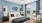 a bedroom with a bed and a fan
